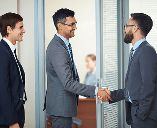 businessmen-closing-deal-with-handshake